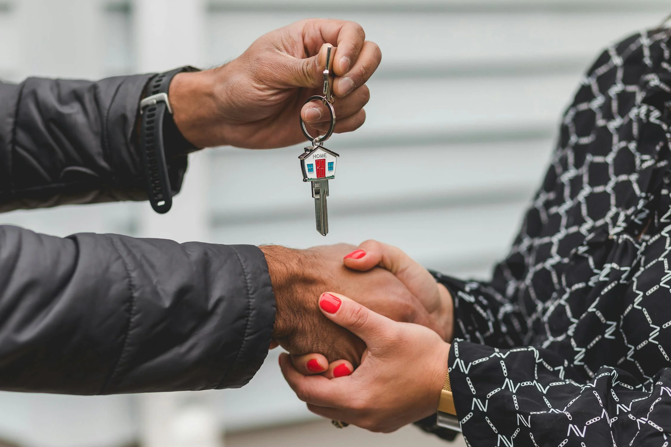Family in front of their new home